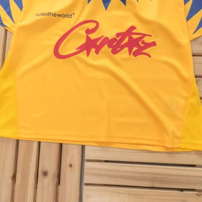 Футболка Corteiz Chisel Colorful Rombs And Collar Decorated By Stripes "Yellow" фото № 3 Футболка Corteiz Chisel Colorful Rombs And Collar Decorated By Stripes "Yellow" фото № 3