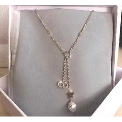 Подвеска Dior Decoration Star And Ball "Gold" фото № 5 Подвеска Dior Decoration Star And Ball "Gold" фото № 5