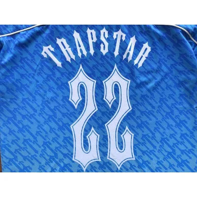 Футболка Trapstar Background From Repeating Small Logos "Blue" фото № 4 Футболка Trapstar Background From Repeating Small Logos "Blue" фото № 4