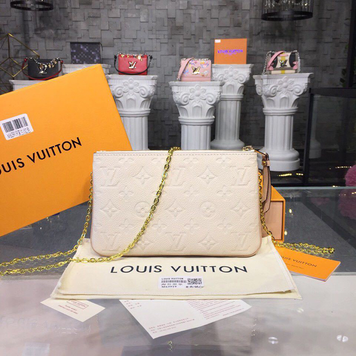 Сумка Louis Vuitton Pochette Double Zip M63919 Monogram Empreinte Leather Dore "Beige" фото № 4