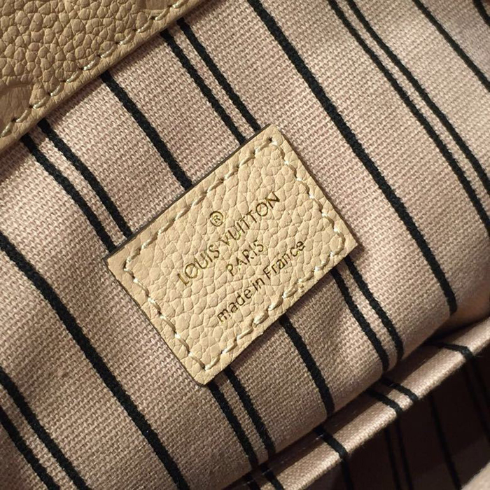 Сумка Louis Vuitton Artsy MM M44243 Monogram Empreinte Leather Papyrus "Beige" фото № 9